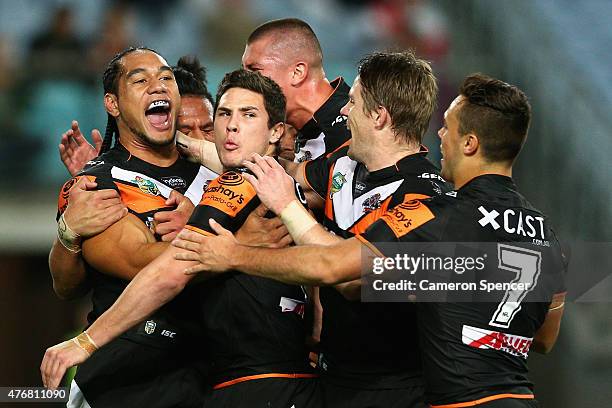 Martin Taupau of the Tigers celebrates scoring a try during the round 14 NRL match between the Wests Tigers and the South Sydney Rabbitohs at ANZ...