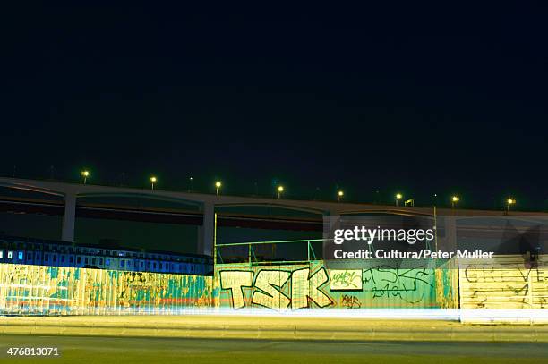 time lapse view of traffic and graffiti - traffic time lapse stock pictures, royalty-free photos & images