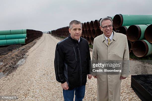 Russell "Russ" Girling, president and chief executive officer of TransCanada Corp., left, and Joe Oliver, Canada's natural resources minister, stand...