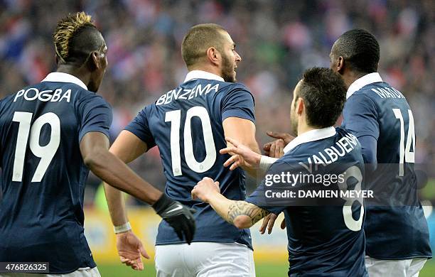 France's forward Karim Benzema is congradulated by France's midfielder Paul Pogba , France's forward Mathieu Valbuena and France's midfielder Blaise...