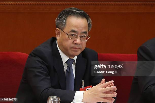Guangdong Communist Party Secretary Hu Chunhua attends the opening session of the National People's Congress at the Great Hall of the People on March...
