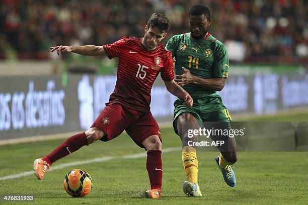 Portugal's forward Rafael Silva "Rafa" vies with Cameroon's defender Aurelien Chedjou during the FIFA 2014 World Cup friendly football match Portugal...