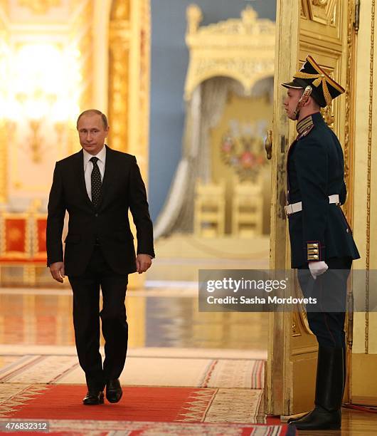 Russian President, Vladimir Putin enters the hall during a presentation ceremony of state awards marking the Day of Russia in the Grand Kremlin...