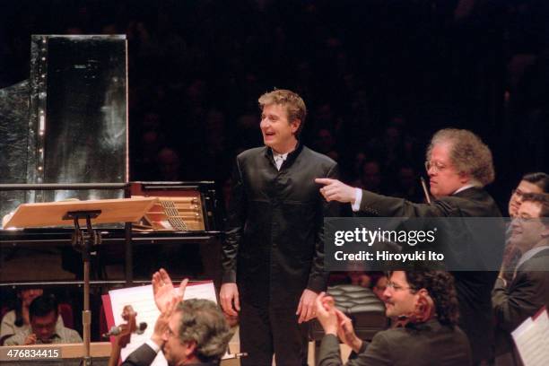 The Met Orchestra performing at Carnegie Hall on Sunday afternoon, May 19, 2002.This image:The pianist Jean-Yves Thibaudet, center, and the conductor...