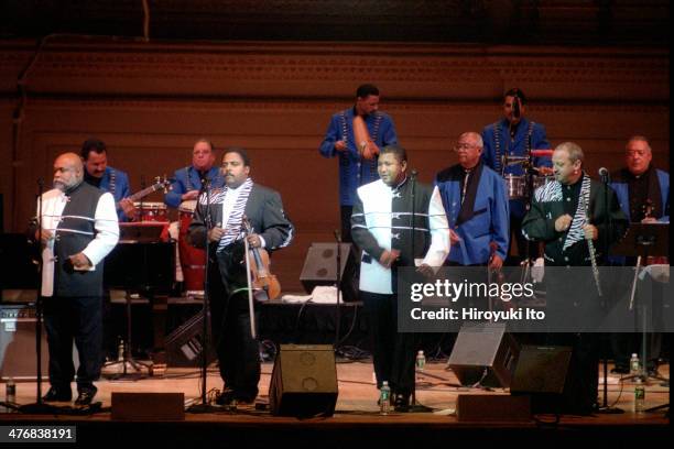Orquesta Aragon performing at Carnegie Hall as part of JVC Jazz Festival on Saturday night, June 29, 2002.This image:From left, Ernesto Bacallao,...