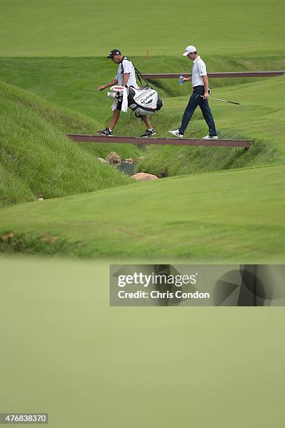 Justin Rose of England walks the 11th fairway during the final round of the Memorial Tournament presented by Nationwide at Muirfield Village Golf...