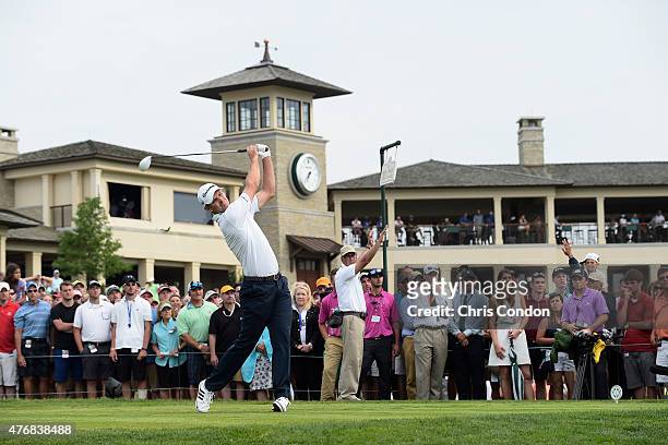 Justin Rose of England stees off on the 10th hole during the final round of the Memorial Tournament presented by Nationwide at Muirfield Village Golf...