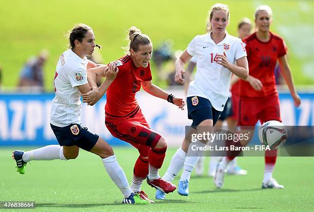 Ingrid Moe Wold of Norway challenges Simone Laudehr of Germany during the FIFA Women's World Cup 2015 Group B match between Germany and Norway at...