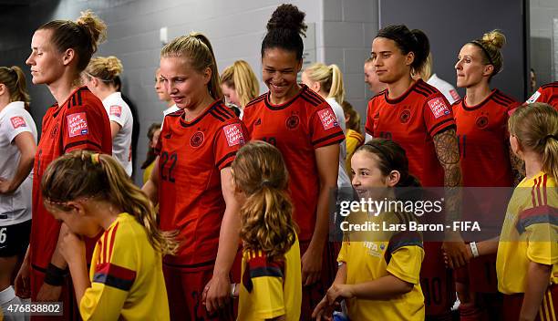 Celia Sasic of Germany smiles with kids during the FIFA Women's World Cup 2015 Group B match between Germany and Norway at Lansdowne Stadium on June...