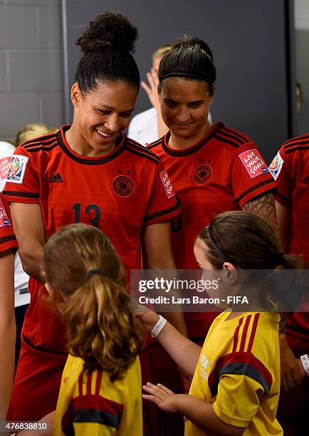 Celia Sasic of Germany smiles with kids during the FIFA Women's World Cup 2015 Group B match between Germany and Norway at Lansdowne Stadium on June...