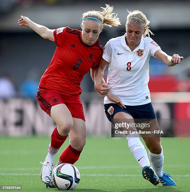 Pauline Bremer of Germany is challenged by Solveig Gulbrandsen of Norway during the FIFA Women's World Cup 2015 Group B match between Germany and...