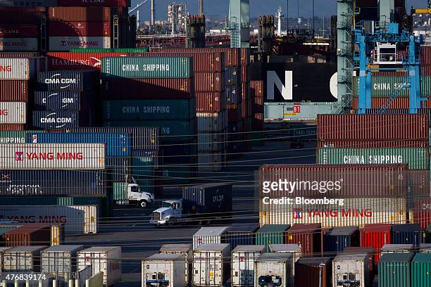 Semi-truck transports a shipping container at the Port of Los Angeles in Los Angeles, California, U.S., on Thursday, June 11, 2015. President Barack...