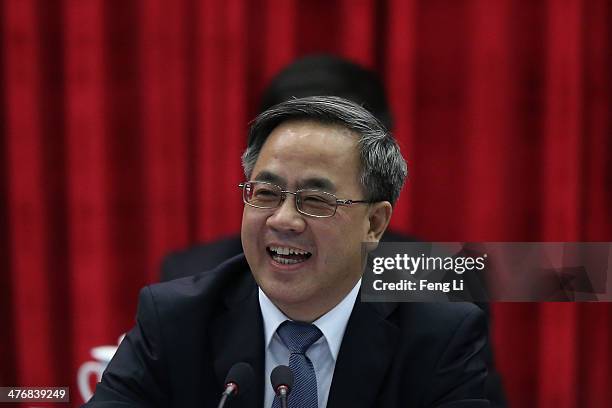 Guangdong Communist Party Secretary Hu Chunhua attends the Guangdong delegation's group meeting during the annual National People's Congress on March...