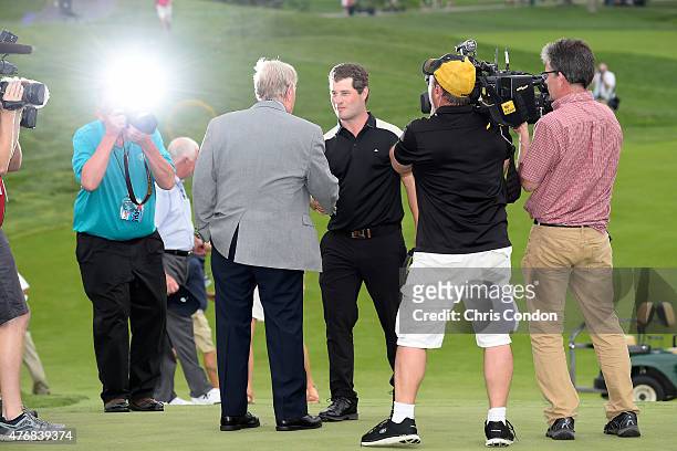 David Lingmerth waits is greeted by tournament host Jack Nicklaus after winning the Memorial Tournament presented by Nationwide at Muirfield Village...