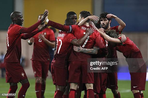 Portugal's players celebrate after scoring during the FIFA 2014 World Cup friendly football match Portugal vs Cameroon at Magalhaes Pessoa stadium in...