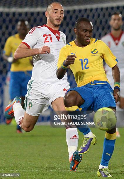 Morocco's Amrabet Noureddine fights for the ball with the Gabon's Abdoulay Tandjigora during an international friendly football match in Marrakech on...