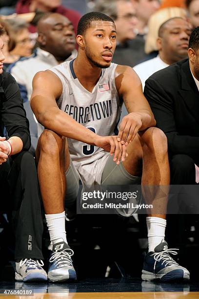 Mikael Hopkins of the Georgetown Hoyas looks on from the bench during a college basketball game against the Xavier Musketeers on February 22, 2014 at...