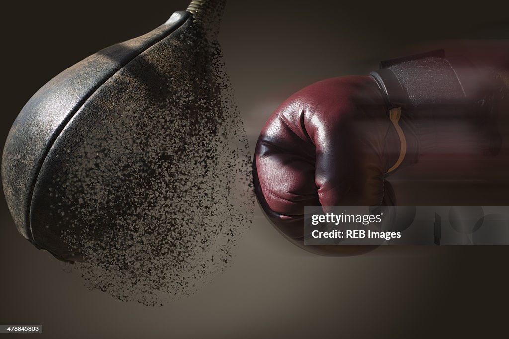 Close up boxer and punch bag with blurred motion