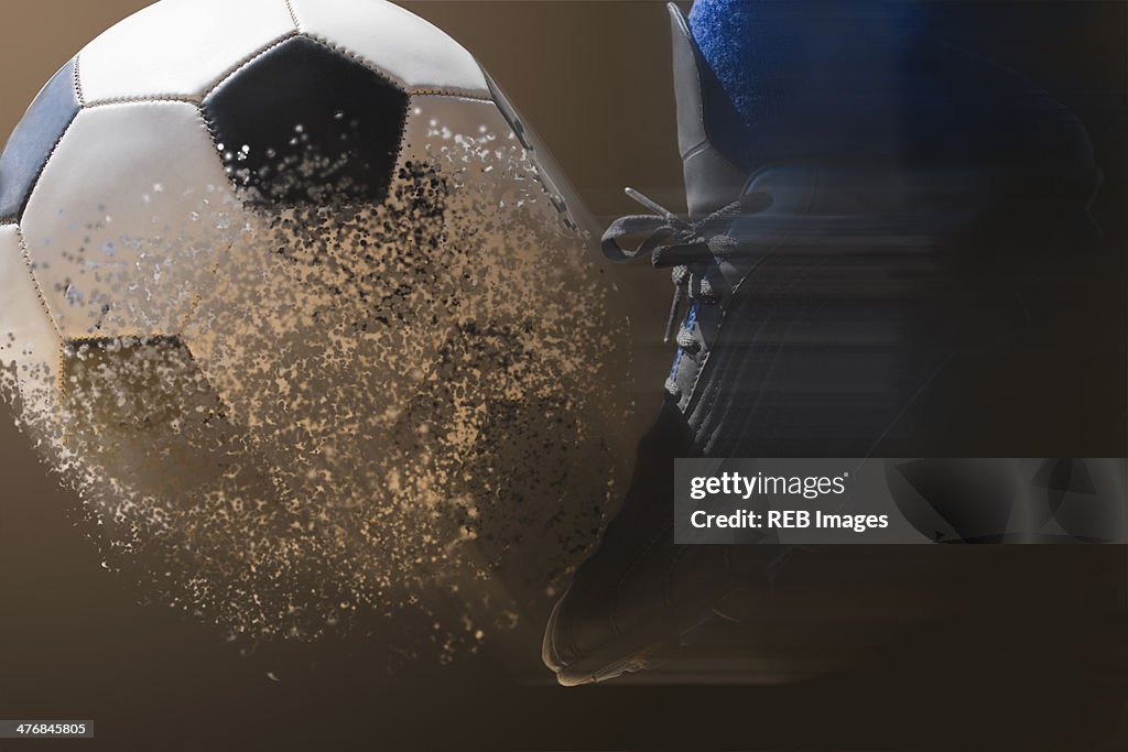 Close up soccer player and football with blurred motion