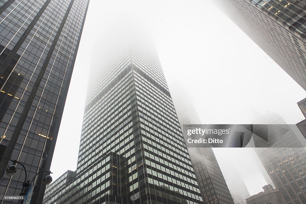 View of skyscrapers in mist, New York City, USA