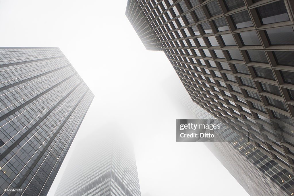 Angled view of skyscrapers in mist, New York City, USA