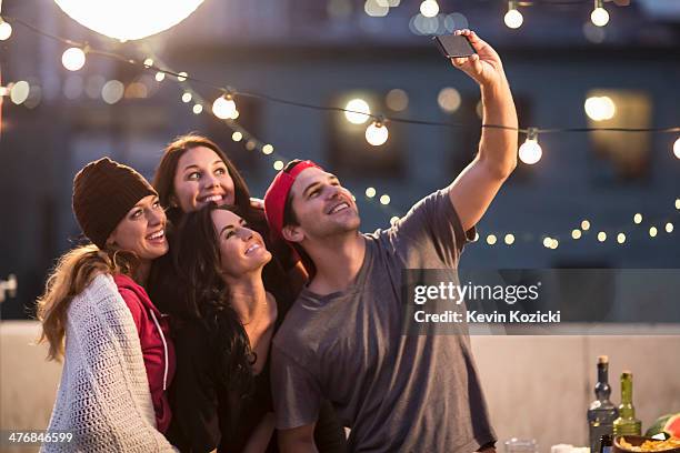 young adult friends taking self portrait at party - la four stock pictures, royalty-free photos & images