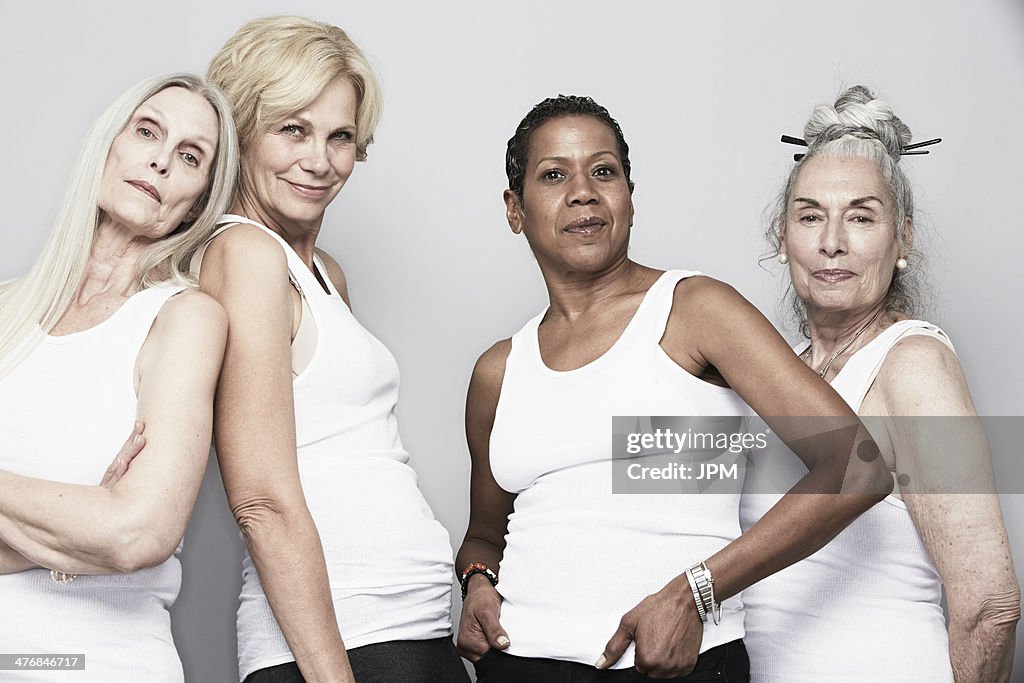 Studio portrait of senior women friends posing for camera