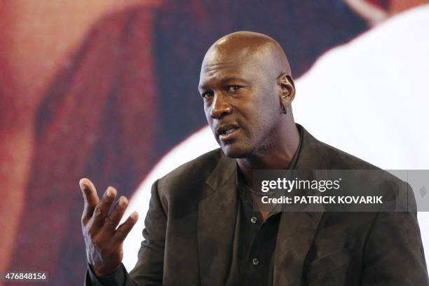 Former professional US basketball player Michael Jordan delivers a press conference at the Palais de Tokyo in Paris on June 12, 2015 to present...