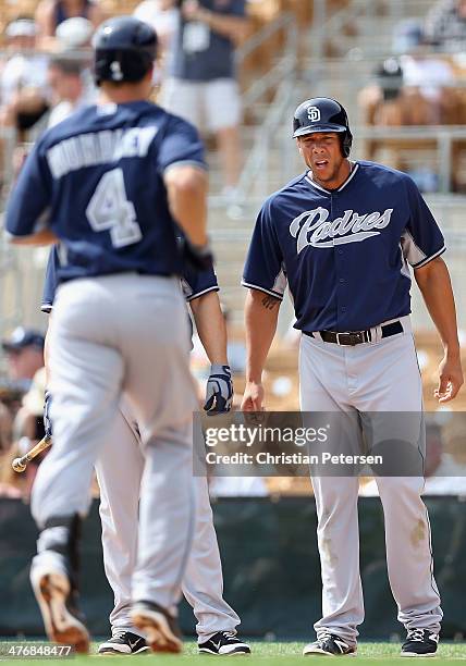 Kyle Blanks of the San Diego Padres congratulates Nick Hundley at home plate after Hundley hit a three-run home run against the Chicago White Sox...