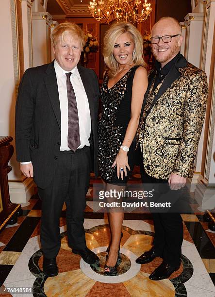 Boris Johnson, Claire Caudwell and John Caudwell attend a dinner hosted by John Caudwell on March 5, 2014 in London, England.
