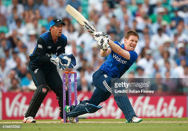 Eoin Morgan of England hits out as Luke Ronchi of New Zealand watches on during the 2nd ODI Royal London One-Day Series 2015 at The Kia Oval on June...