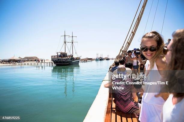 tourists on pirate ship, djerba, tunisia - tourism in tunisia stock pictures, royalty-free photos & images