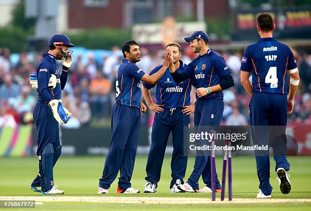 Ravi Bopara of Essex is congratulated by his team after bowling out Craig Cachopa of Sussex during the T20 Blast match between Sussex Sharks and...