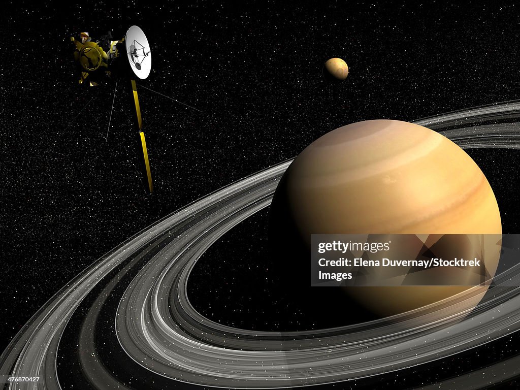 Cassini spacecraft orbiting Saturn and and its moon Titan.