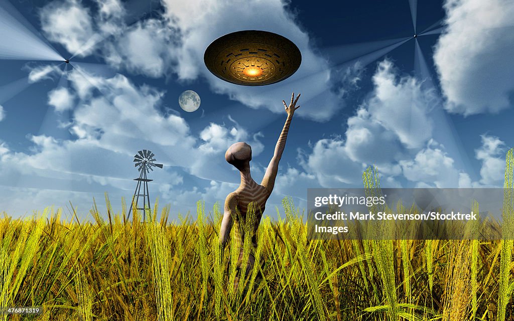 An alien being directing its spacecraft to make crop circles.