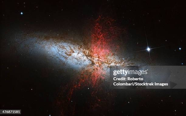 messier 82, a starburst galaxy in the constellation ursa major. - galaxia-starburst fotografías e imágenes de stock