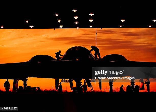 during early morning operations, 131st bomb wing missouri air national guard mantainers service a b-2 spirit stealth bomber at whiteman air force base, missouri. - air force operations stock pictures, royalty-free photos & images