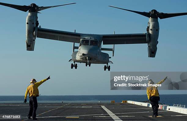 aviation boatswain's mates direct an mv-22 osprey as it launches from the flight deck. - ground crew stock pictures, royalty-free photos & images