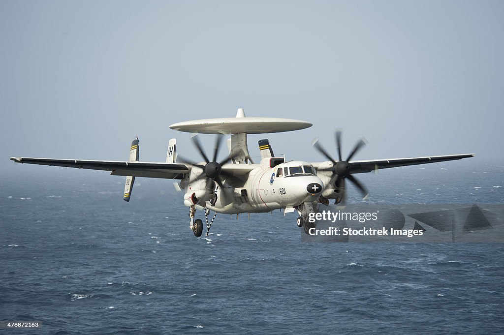 North Arabian Sea, July 22, 2013 - An E-2C Hawkeye prepares to land on the flight deck of the aircraft carrier USS Nimitz.