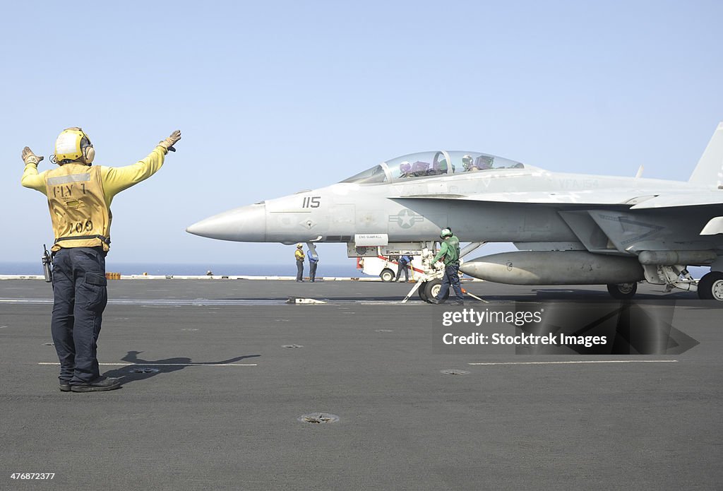 Red Sea, September 4, 2013 - An F/A-18F Super Hornet prepares to launch off the flight deck of the aircraft carrier USS Nimitz.