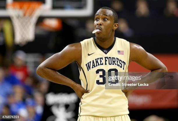 Travis McKie of the Wake Forest Demon Deacons reacts during their game against the Duke Blue Devils at Joel Coliseum on March 5, 2014 in...