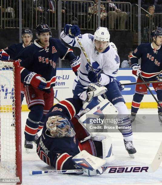 Henrik Lundqvist of the New York Rangers makes the first period stop on James van Riemsdyk of the Toronto Maple Leafs at Madison Square Garden on...