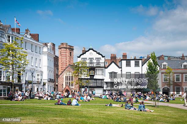 people relaxing in a city park - exeter devon stock pictures, royalty-free photos & images