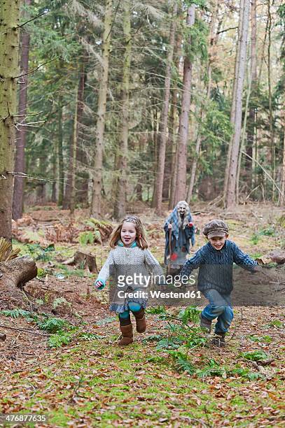 germany, north rhine-westphalia, moenchengladbach, scene from fairy tale hansel and gretel, children running from witch - around magic day three stock pictures, royalty-free photos & images
