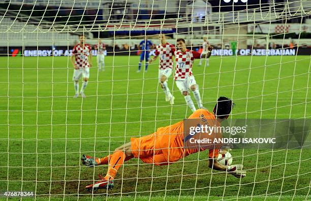 Italia's goalkeeper Gianluigi Buffon saves a penalty kick from Croatia's forward Mario Mandzukic during the Euro 2016 qualifying football match...