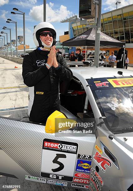 Hunter Mahan prepares to ride along in the Cadillac V-Series Challenge driving experience at the Homestead-Miami Speedway for the World Golf...