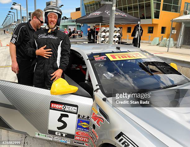 Graham DeLaet of Canada catches his breath as he exits from a high-speed trip in the Cadillac CTS-V Racecar during the Cadillac V-Series Challenge...