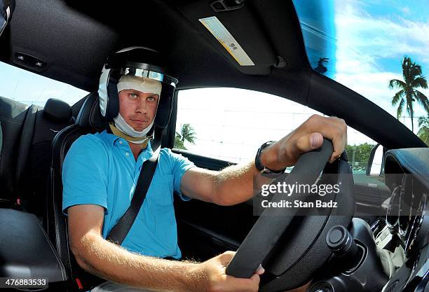 Harris English races car around the track during the Cadillac V-Series Challenge driving experience at the Homestead-Miami Speedway for the World...