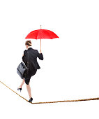 usiness Woman Balancing Worklife Tightrope on White Background