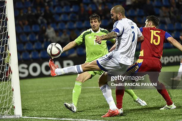 Cyprus defender Valentinos Sielis vies with Andorra's goalkeeper Ferran Pol and Andorra's defender Adrian Rodrigues during the Euro Cup 2016...